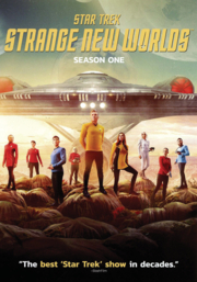 Starfleet officers in front of space ship