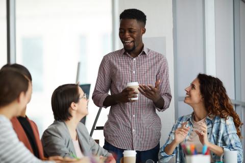 4 people talking in a group