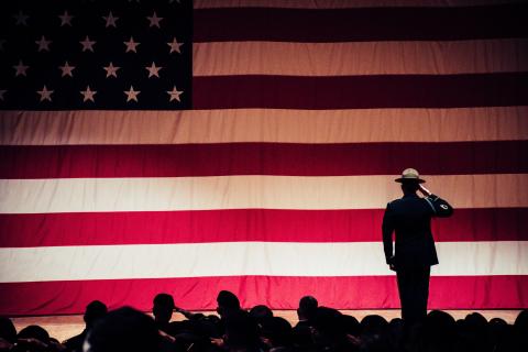 American Flag with soldier saluting